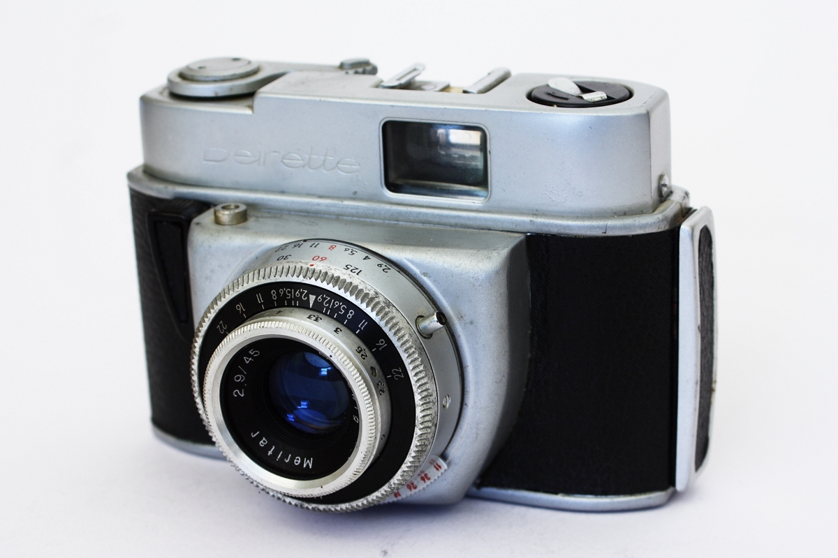 a silver and black vintage camera