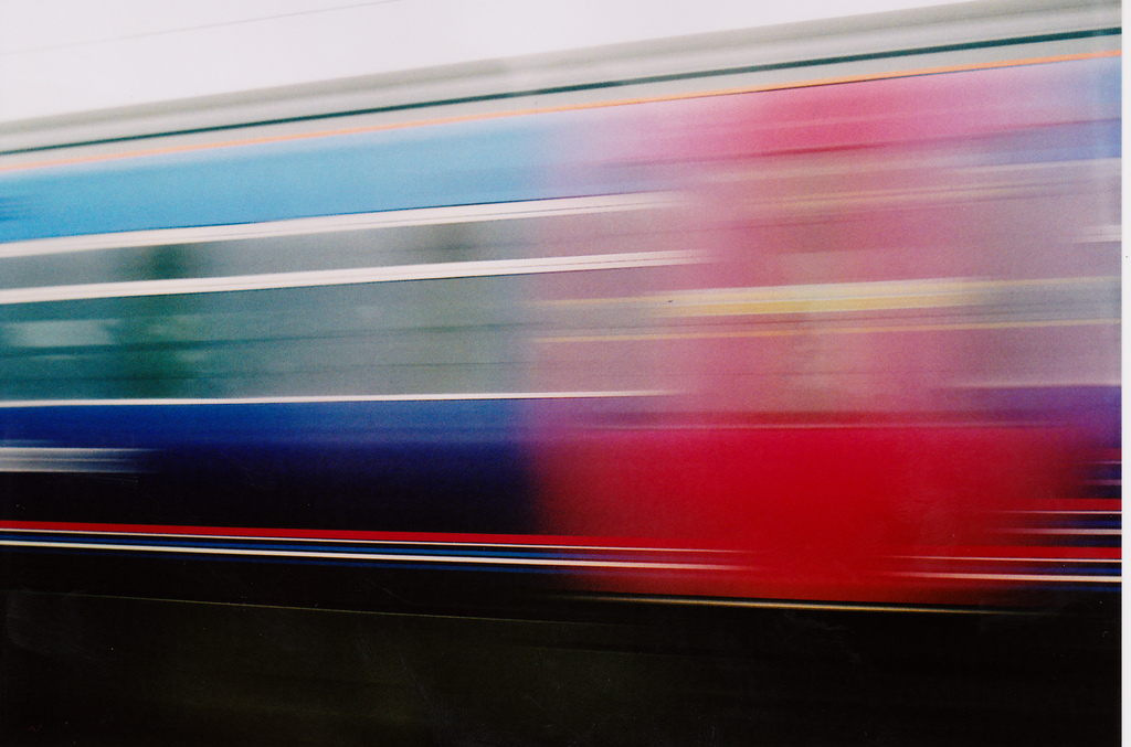 A very motion blurred image of a train