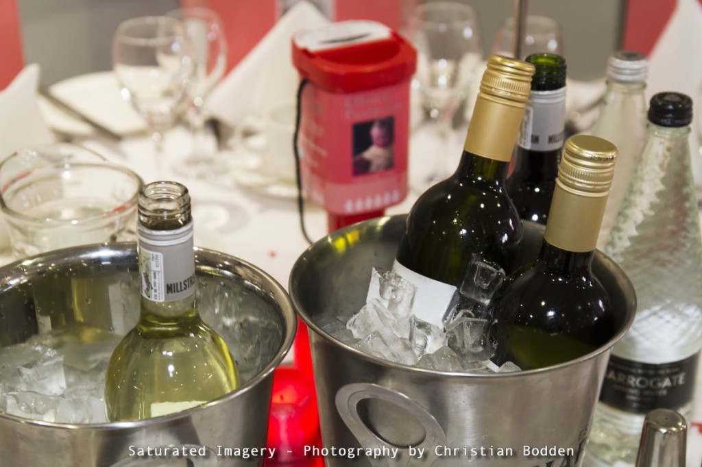 wine bottles on a table at a function