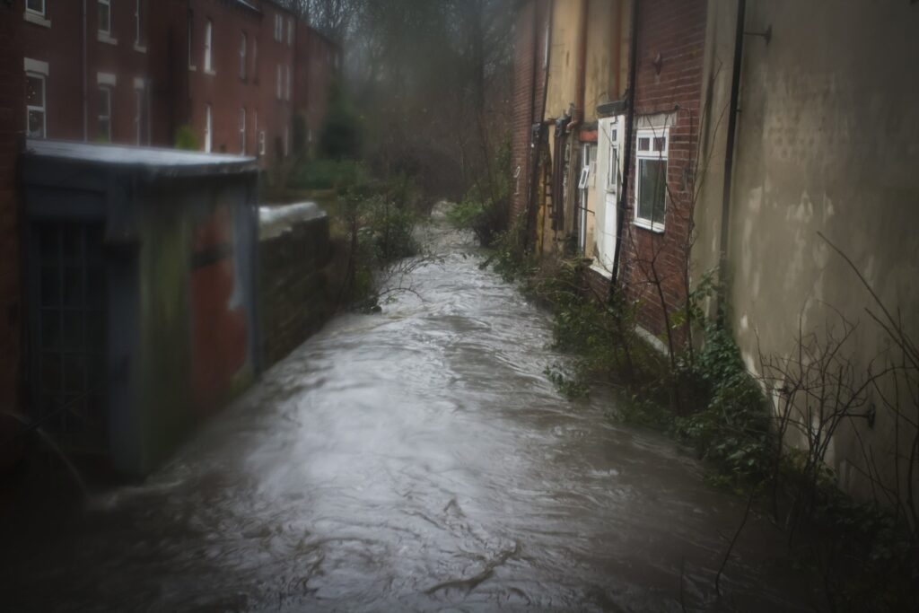 Flooded beck between houses