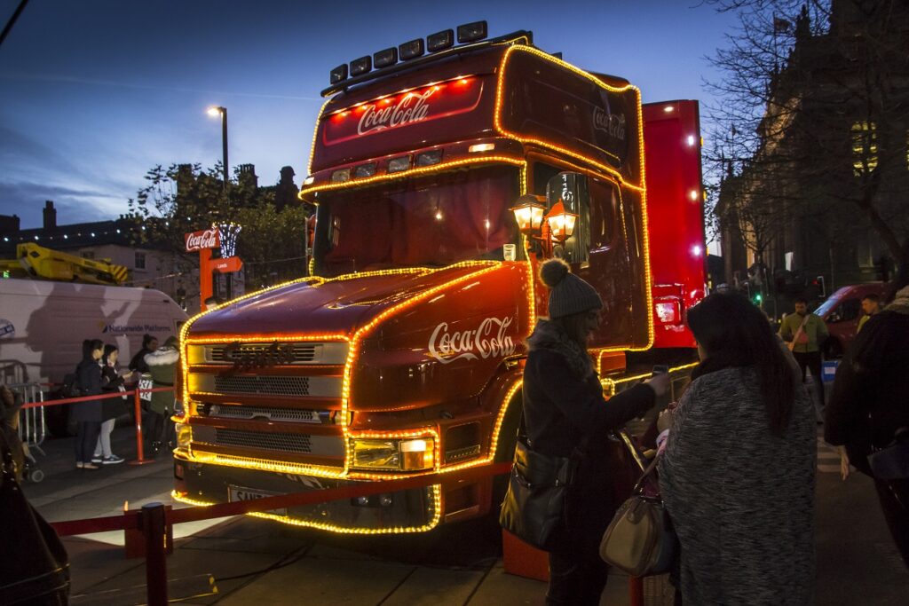 Coca Cola Branded Truck in twilight glowing up bright